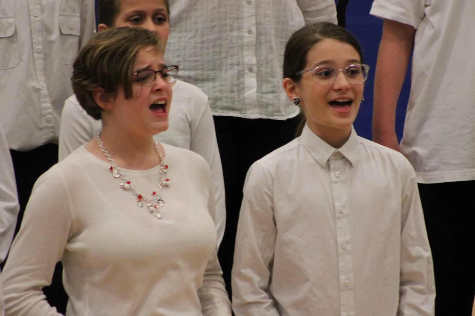 close up of two girls singing